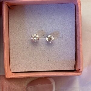 14K white gold solitaire CZ diamond earrings.